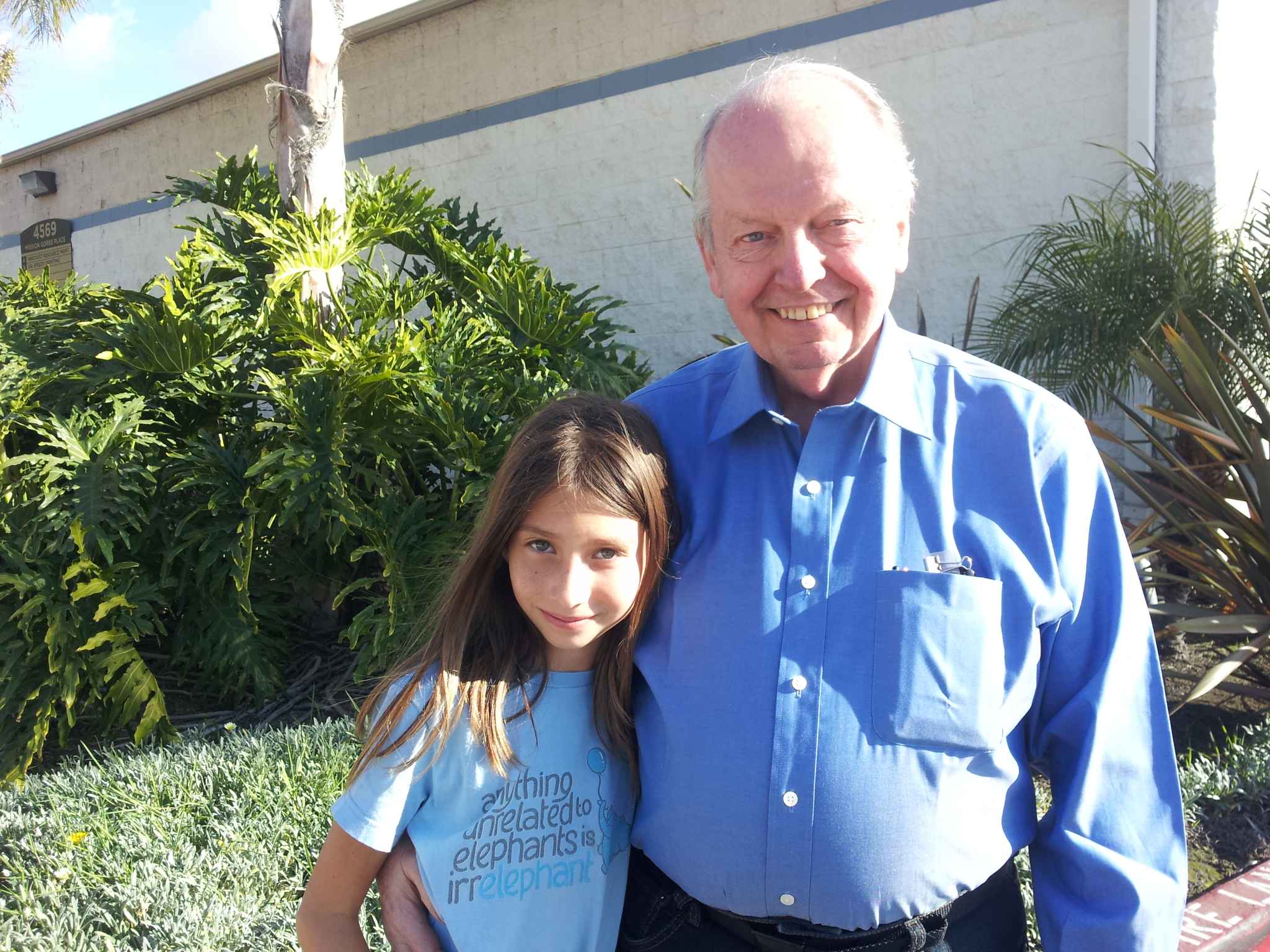 Grandpa Ward and Helen outside the office.