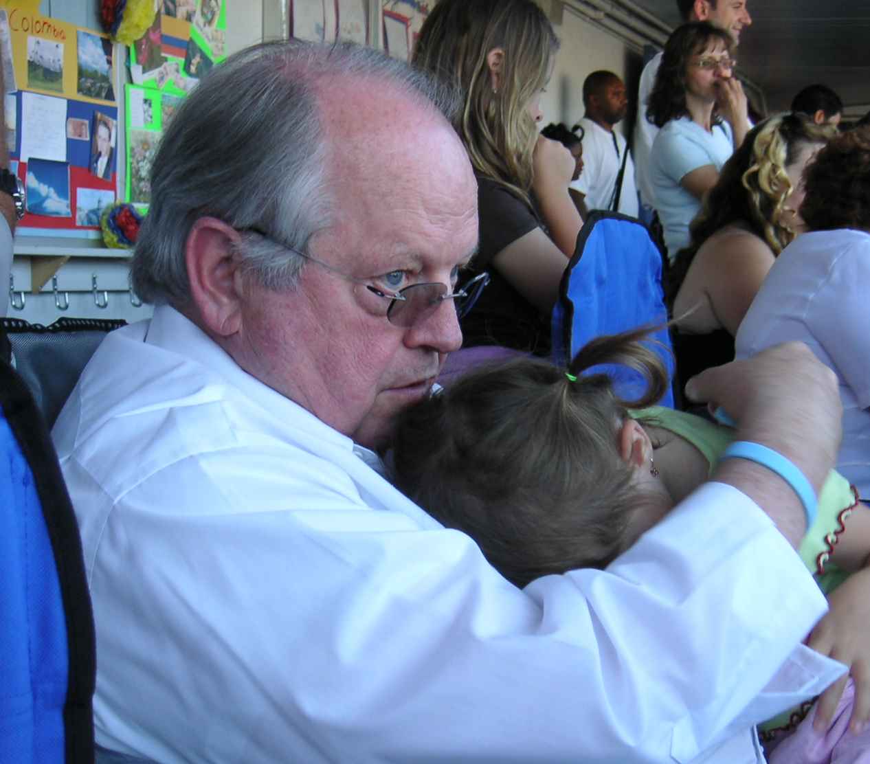 Grandpa Ward & Helen watching kindergarten graduation